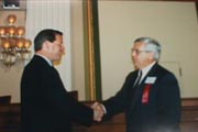 A picture of State Attorney Wolfinger receiving the 1996 Public Service Excellence Award from Vice-President Al Gore. 