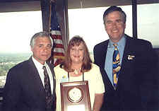A picture of Governor Bush and Attorney General Butterworth with the 2000 Florida Victim Advocate of the Year Winner, Beth Rossman