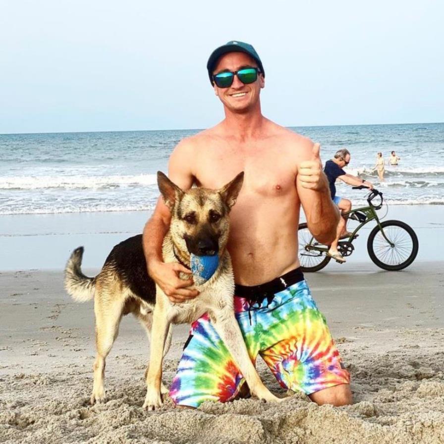 Photo of victims Matthew Nicol and his dog, Mako, at the beach.